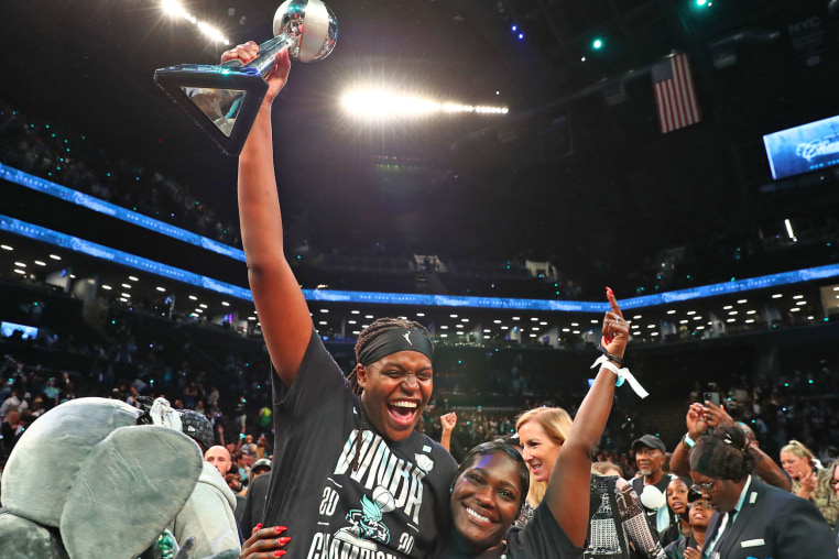 Jonquel Jones of the New York Liberty celebrates with the 2024 WNBA Finals MVP trophy.