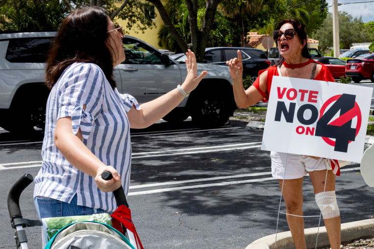 Two women argue at Harris Campaign Reproductive Rights Bus Tour stop