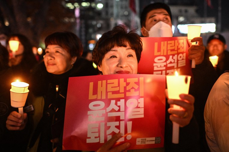 Protesters smiling during a vigil