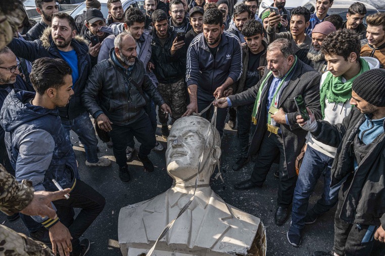 Statues of Hafez al-Assad toppled by people in Syria