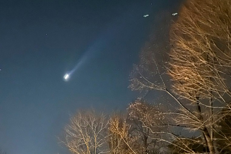 A drone is seen in the night sky