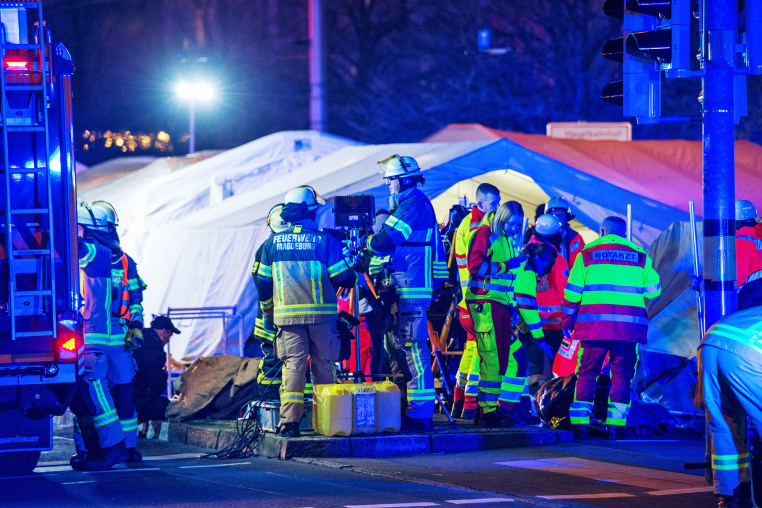 Emergency personnel next to the Christmas market after a car reportedly plowed into the crowd in Magdeburg, Germany. 