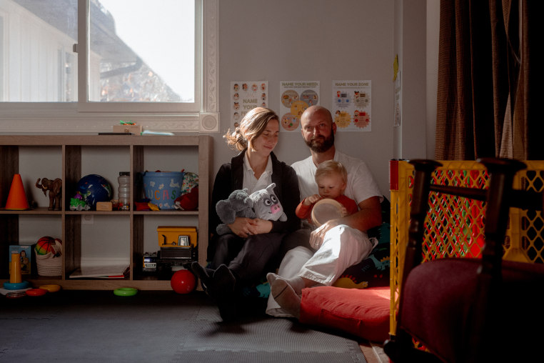 Andrew Sheffield and Rachel Kaplan with their son, Lucas, in their home in Arden, N.C., 