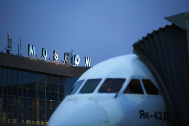 A logo sits illuminated above the passenger terminal at Domodedovo Airport ZAO in Domodedovo, Russia, on Friday, April 21, 2017. 