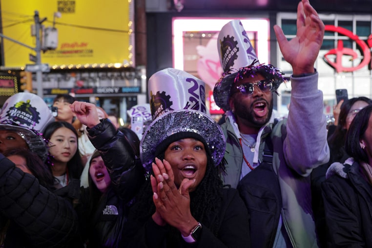 People gather inTimes Square to watch the ball drop on New Year's Eve in New York City, U.S., December 31, 2024. 