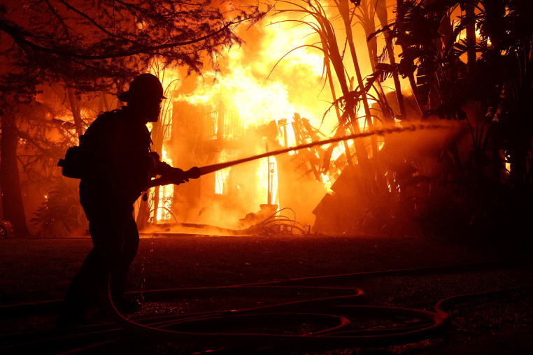 Image: Powerful Winds Fuel Multiple Fires Across Los Angeles Area silhouette firefighter eaton fire wildfire