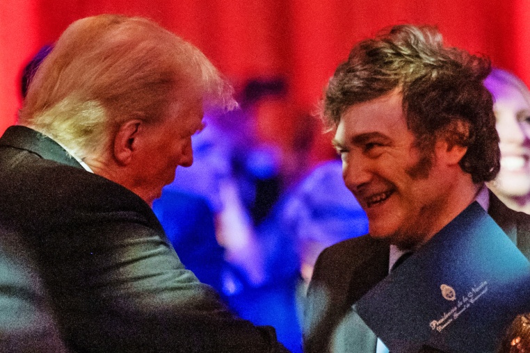 President-elect Donald Trump shakes hands with Argentine President Javier Milei at the America First Policy Institute gala at Mar-A-Lago in Palm Beach, Fla., on Nov. 14, 2024. 