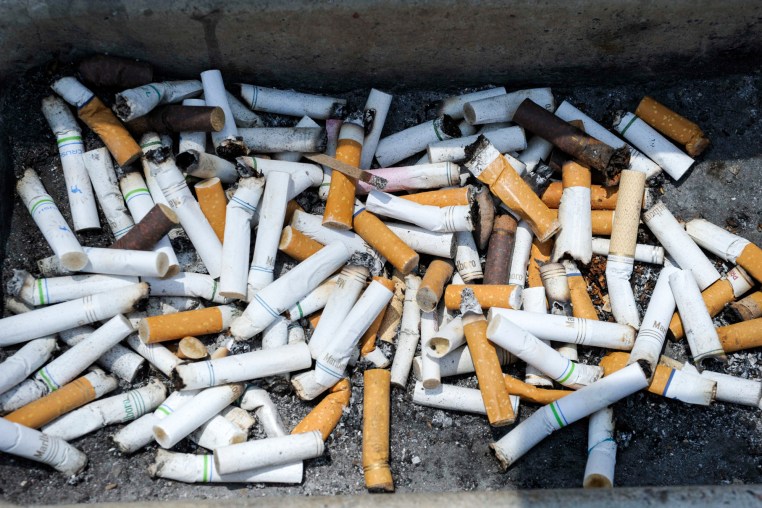 Cigarette butts piled outside