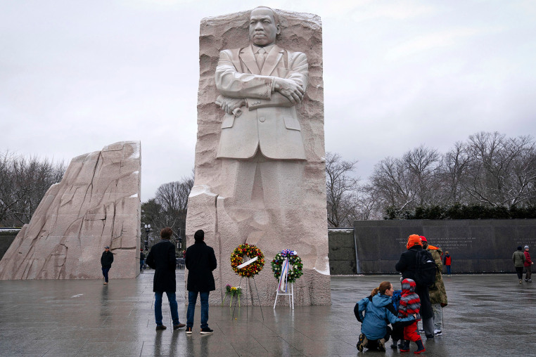 People gather at the Martin Luther King Jr. Memorial 