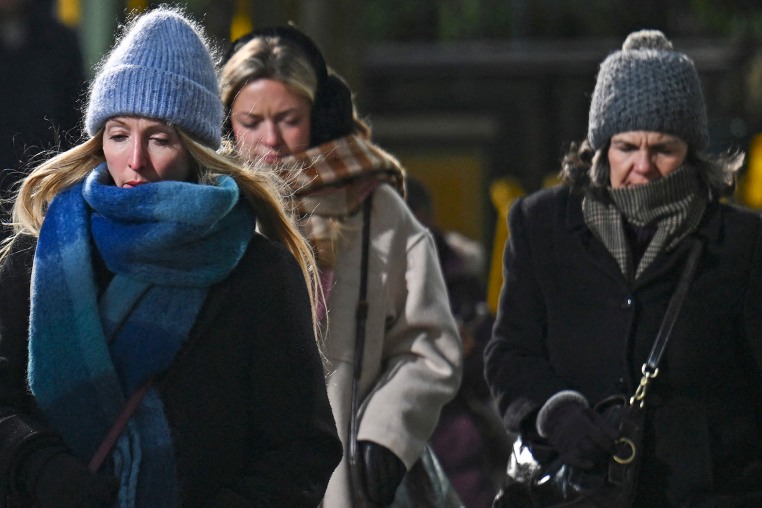 Pedestrians are bundled up against the cold in Midtown Manhattan 