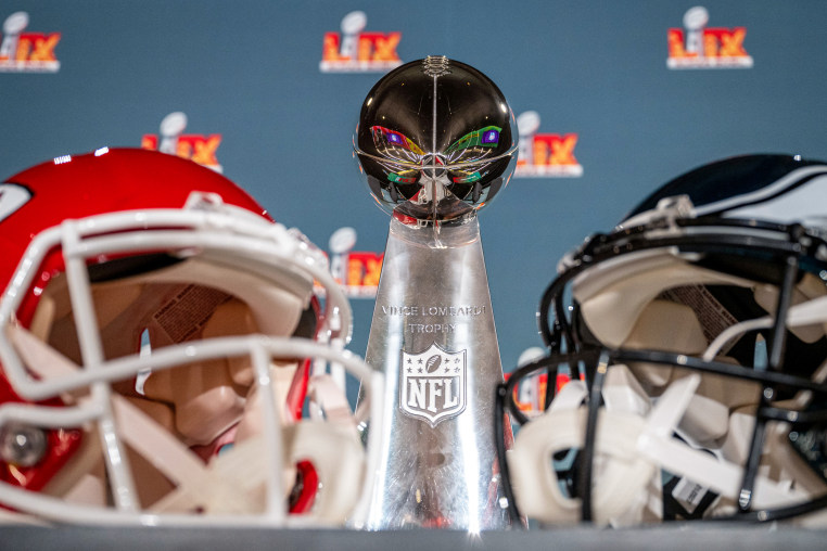 The Vince Lombardy Trophy and the two helmets of the participating teams, Kansas City Chiefs and Philadelphia Eagles. 