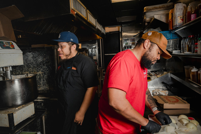 Down North Pizza staff Kaseem Ali, left, with executive chef Michael Carter, in the kitchen