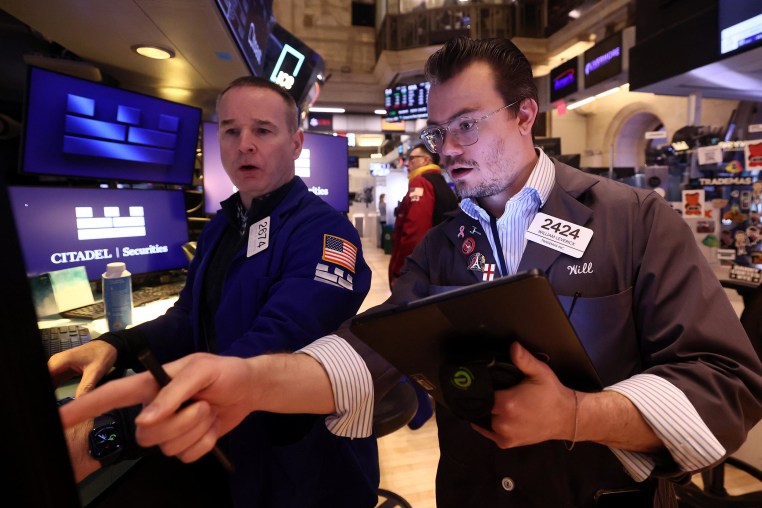 Traders work on the floor of the New York Stock Exchange during morning trading on Feb. 19, 2025. 

