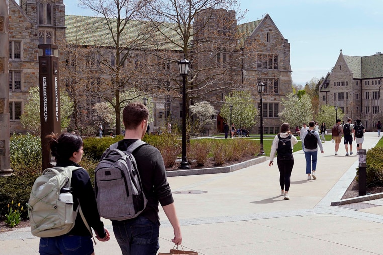 Students walk on the campus of Boston College in 2024.