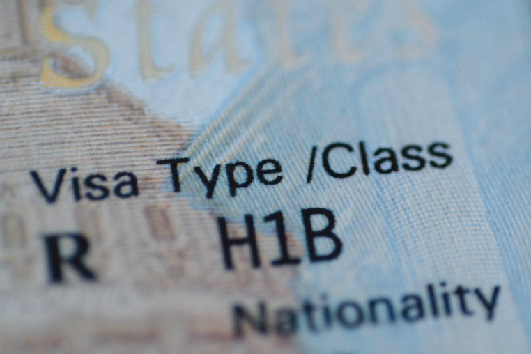 A detail of a H1B visa stamp in a passport.