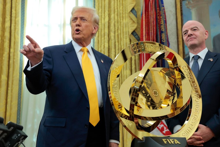 President Donald Trump speaks alongside FIFA President Gianni Infantino after unveiling the 2025 Club World Cup trophy in the Oval Office on March 7, 2025.