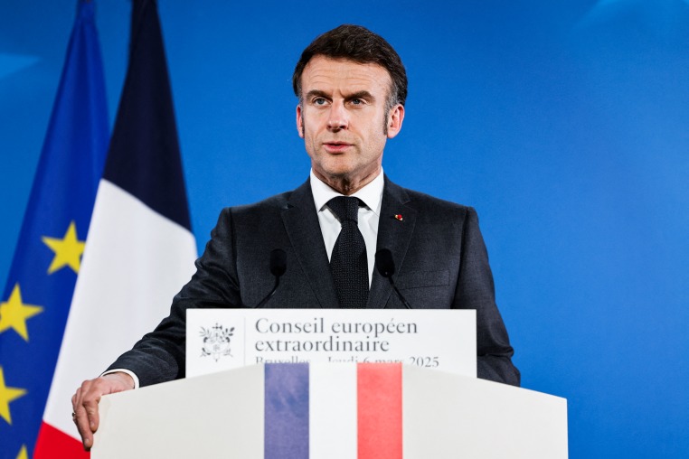 Emmanuel Macron speaks at a podium