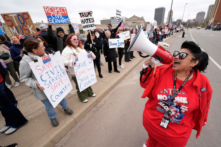 Internal Revenue Service employee Diane LeDesna, from Kansas City, Mo., leads protesters supporting federal workers outside the IRS regional office Saturday, March 15, 2025, in Kansas City, Mo. 