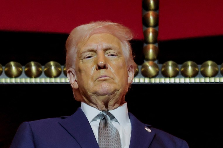 President Donald Trump stands at the presidential box at the Kennedy Center in Washington