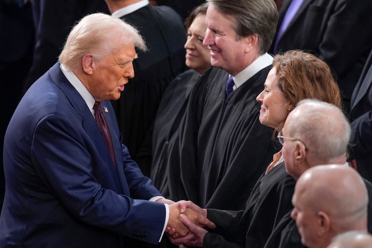 President Donald Trump greets justices of the Supreme Court, from left, Elena Kagan, Bret Kavanaugh, and Amy Coney Barrett, before addressing a joint session of Congress on March 4, 2025.