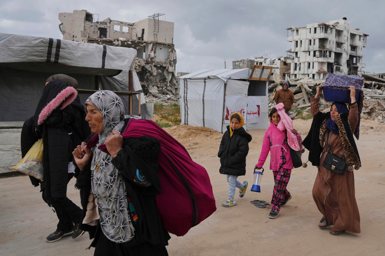 Palestinians flee from increased Israeli military activity on the outskirts of Beit Lahia