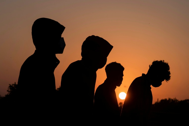 Silhouetted unidentified minor migrants