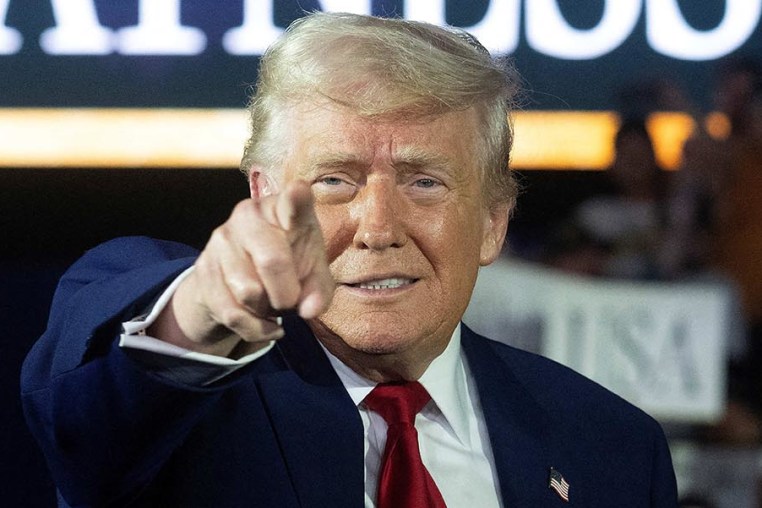 President Donald Trump arrives to deliver a speech marking his 100th day in office in Warren, Mich.