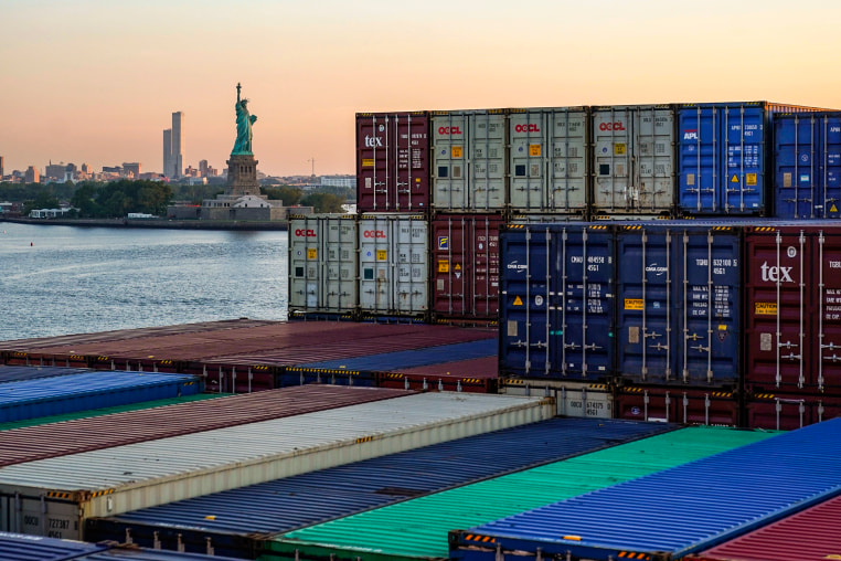 A container ship makes its way through New York Harbor