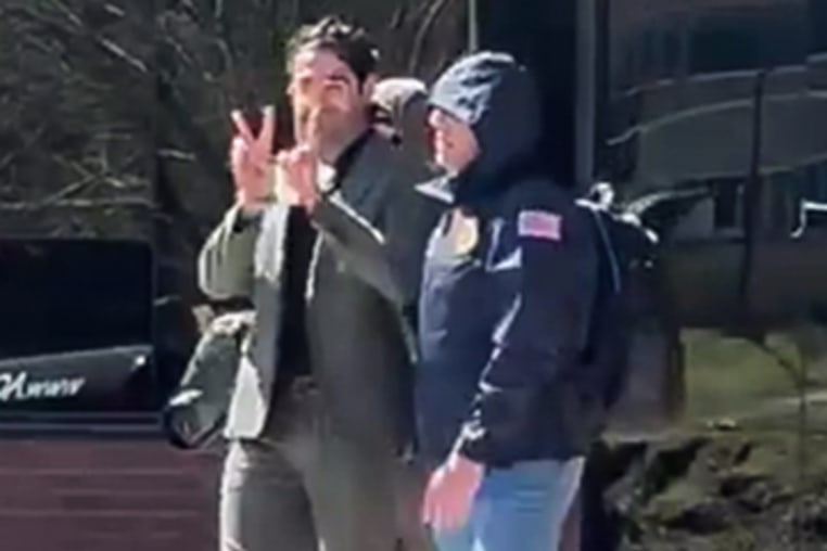Mohsen Mahdawi being escorted by authorities in Colchester, Vt., on April 14, 2025.