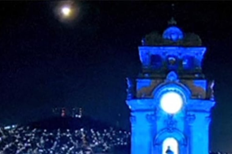 A bright object lights up the sky over Mexico City early Wednesday, April 16, 2025. 