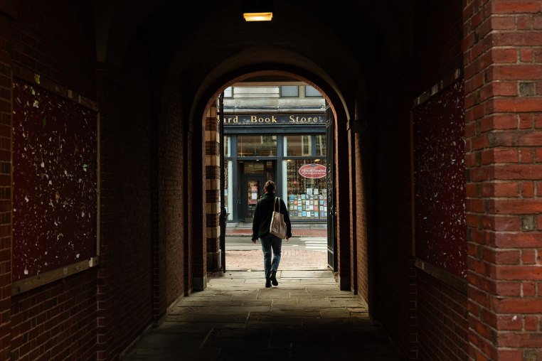 A pedestrian exits Harvard University campus in Cambridge