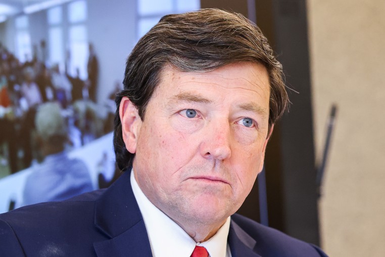 Edward Martin listening during a meeting