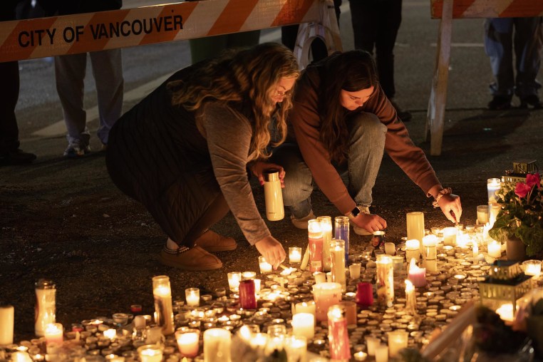 Mourners attend a candlelight vigil near the scene where a car drove into a crowd of people during the Lapu Lapu Festival on April 27, 2025 in Vancouver, Canada.  