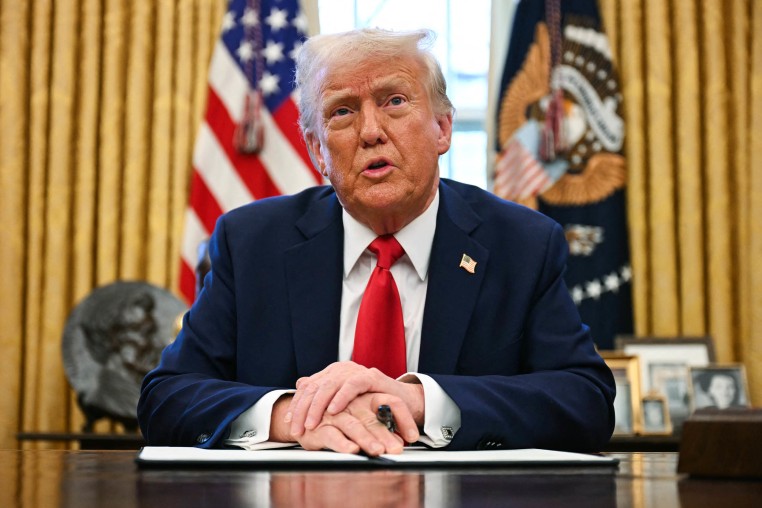 President Donald Trump speaks to the press in the Oval Office of the White House