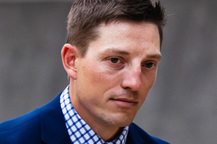 Former Grand Rapids Police officer Christopher Schurr enters the Kent County Courthouse in Grand Rapids, Mich., on May 2, 2025. 