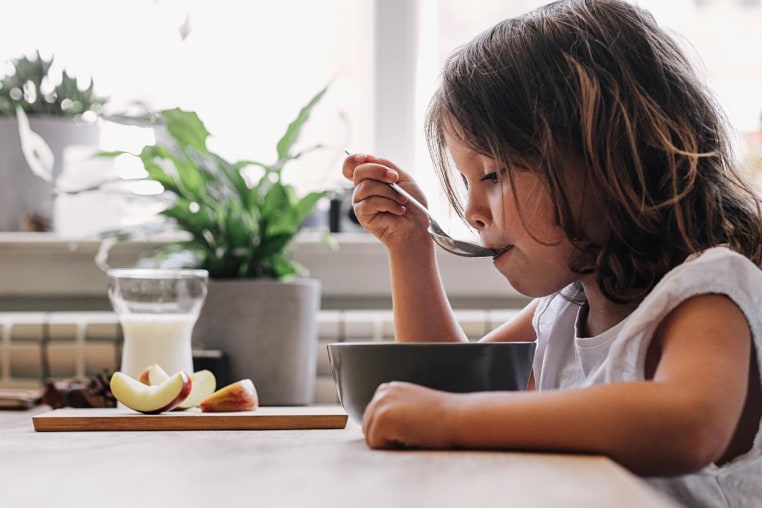 Girl eating breakfast