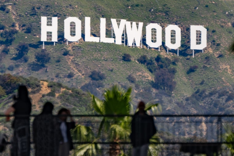 People look at the Hollywood sign  from Hollywood & Highland 
