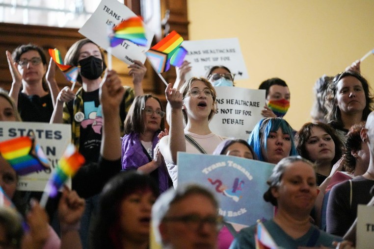 Activists protest Senate Bill 14, which bans gender-affirming medical care for transgender children, at the Texas Capitol in May 2023. 