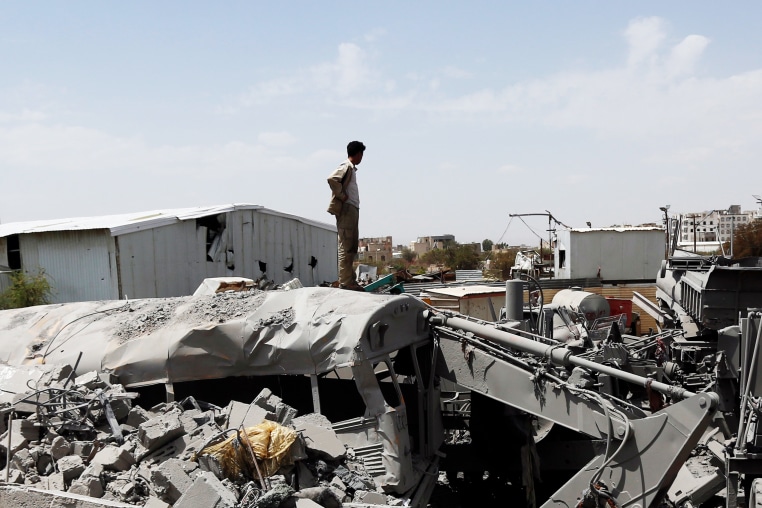 A man inspects damage