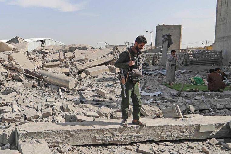 A Houthi fighter surveys the damage following overnight strikes attributed by the Yemeni media to the U.S., in Sanaa, Yemen, on April 27, 2025.