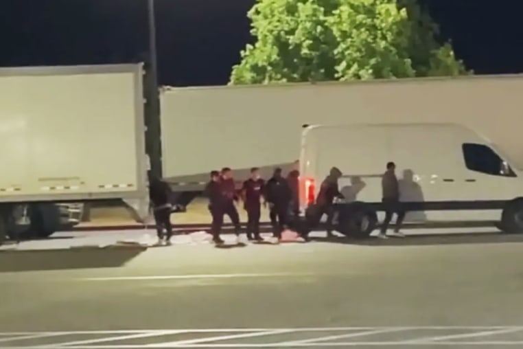 A group of suspects stealing cargo from a truck and loading it into their vehicle last year in California.