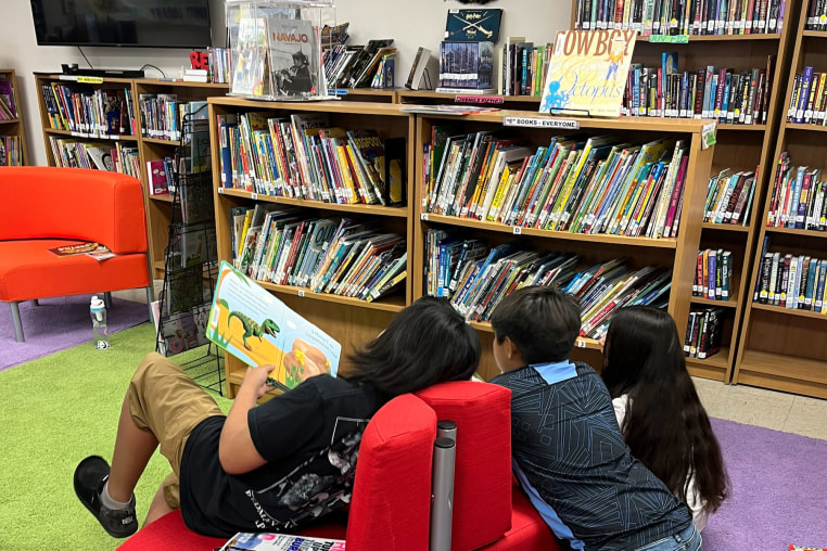 Children reading in the Santa Clara Pueblo Community Library.