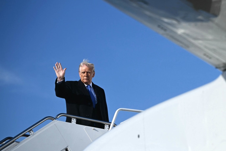 President Donald Trump waves as he boards Air Force One at Joint Base Andrews in Maryland.