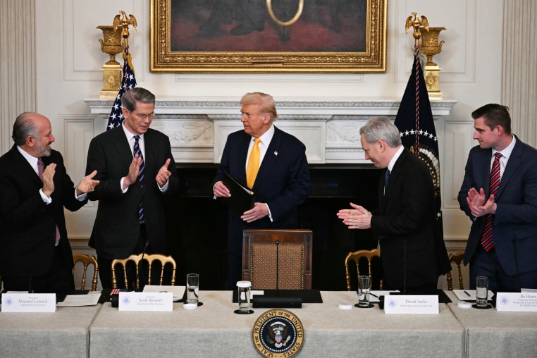 Attendees applaud Donald Trump
