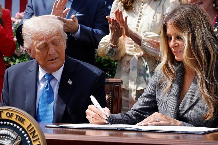 First lady Melania Trump signs the "Take It Down Act" in the Rose Garden of the White House on May 19, 2025.