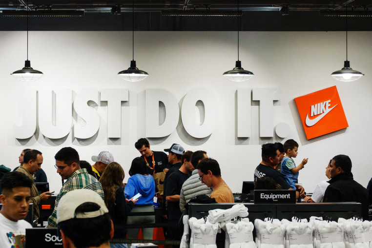 Customers wait in line