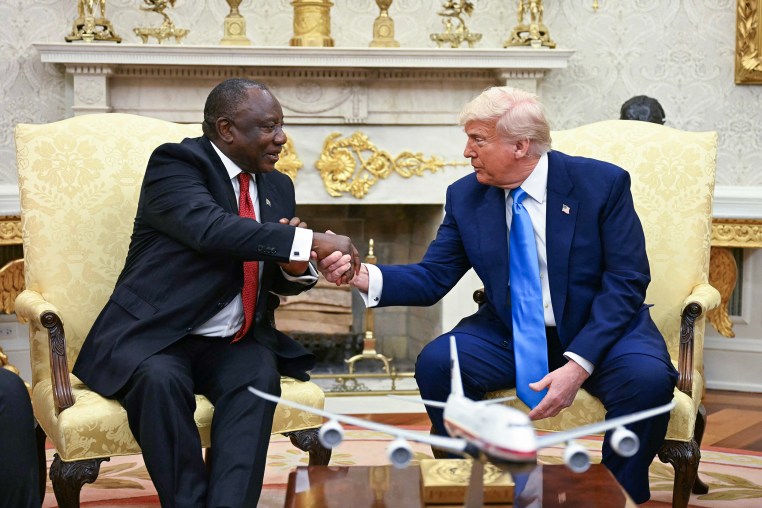 President Donald Trump shakes hands with South African President Cyril Ramaphosa in the Oval Office