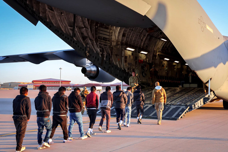 An image shared by Press Secretary Karoline Leavitt on January 24 of a deportation flight.
