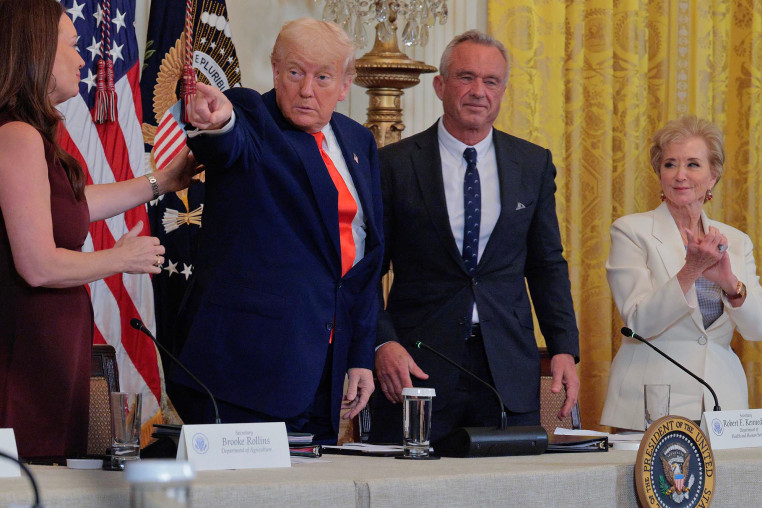 Agriculture Secretary Brooke Rollins, President Donald Trump, Health and Human Services Secretary Robert F. Kennedy Jr. and Education Secretary Linda McMahon attend and release event for a new a "Make America Healthy Again" event at the White House on May 22, 2025.
