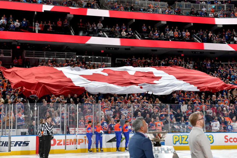 Edmonton Oilers fans unfurl a huge Canadian flag at game